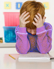 A boy struggling to read